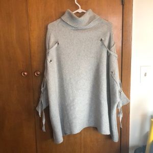 Sweater with string on sides